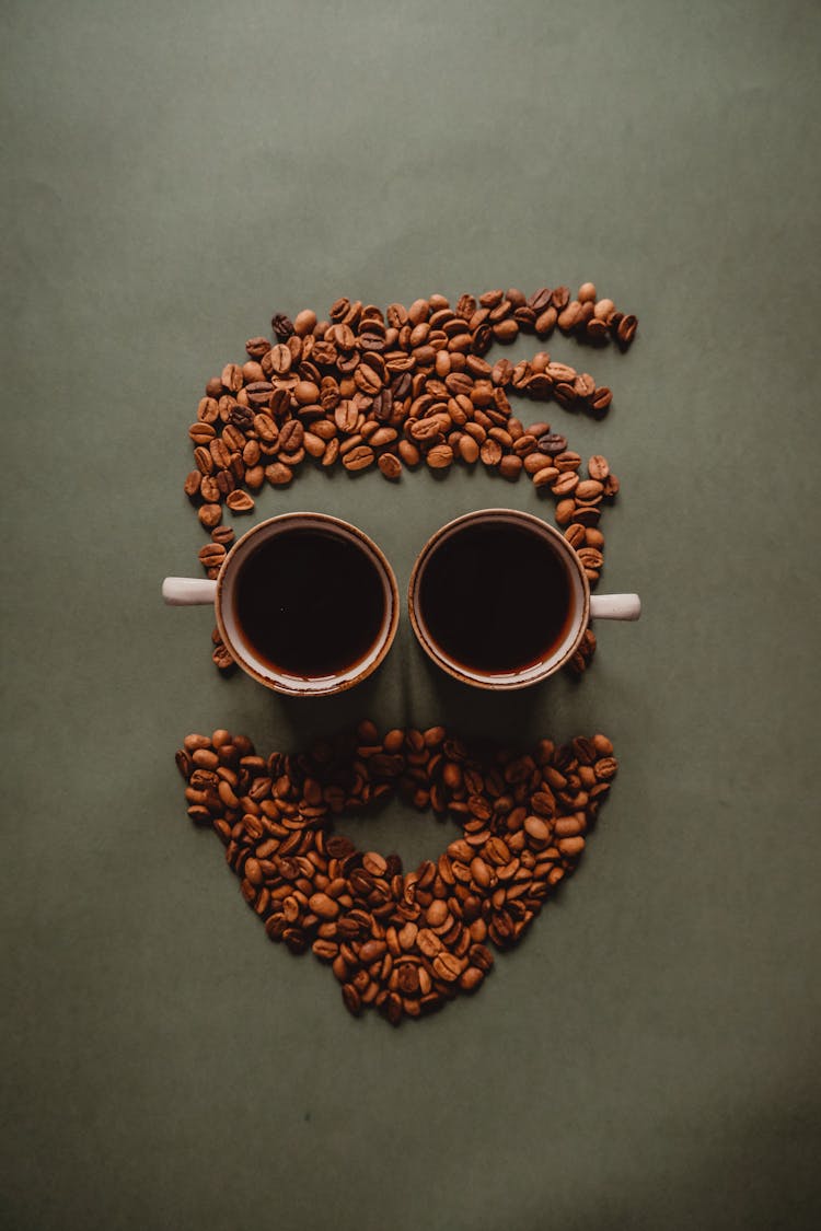 Hipster Head Made From Coffee Beans And Cups