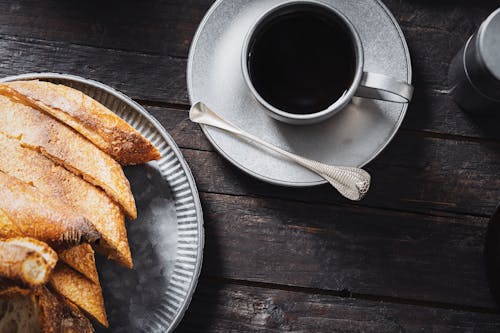 Free Black Coffee and Fresh Bread on Table Stock Photo
