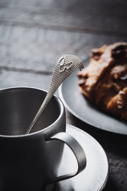 Free Silver Design Spoon in Cup on Table Stock Photo