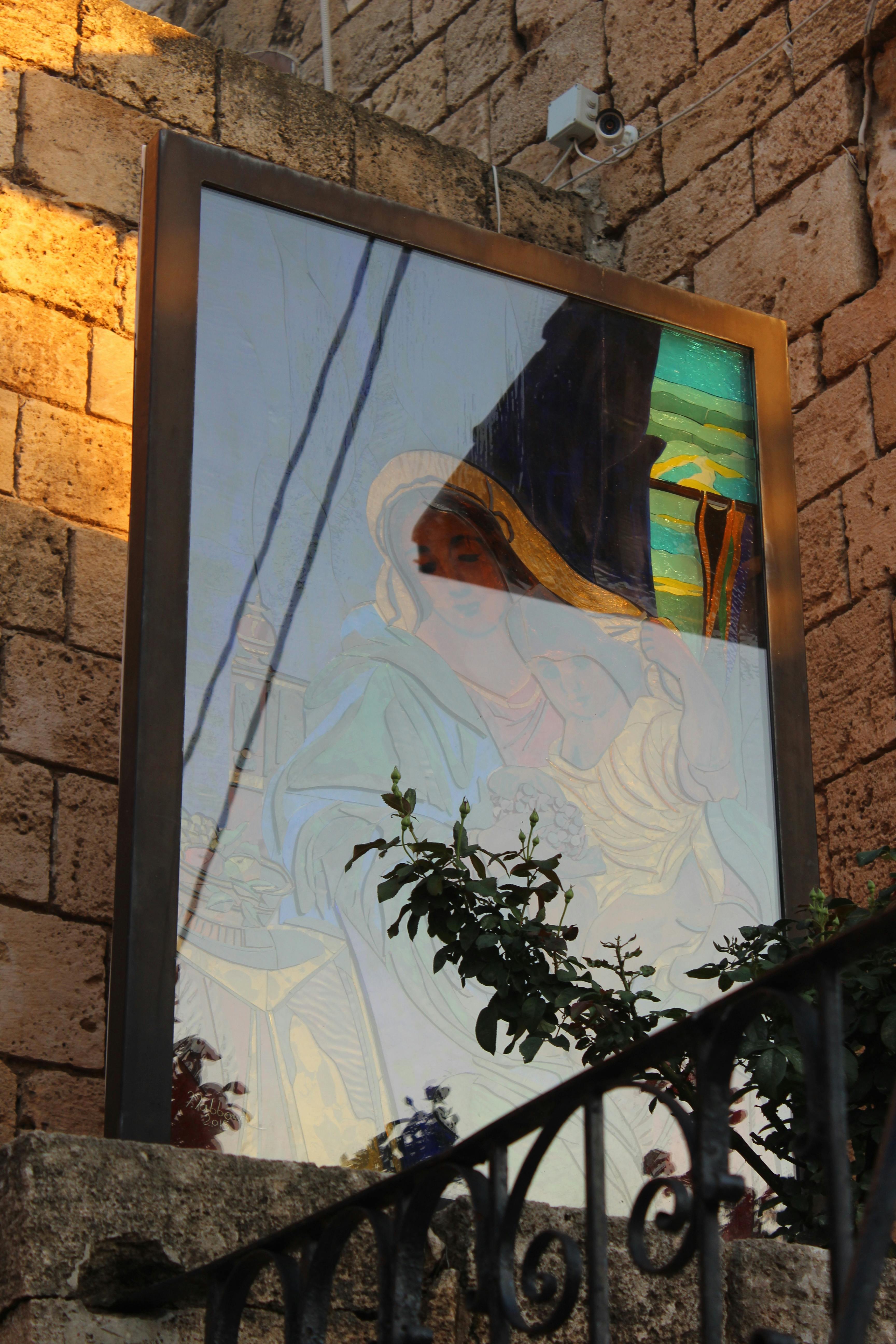 A dramatic statue of a Greek goddess, representing the mythological themes of the game.