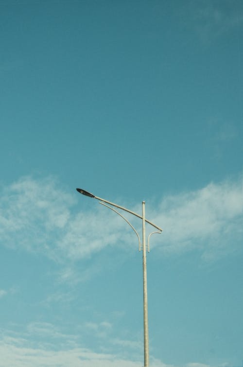 Streetlight against White Clouds