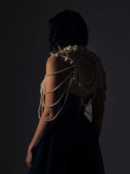 Back of a Woman in a Dress and Jewelry