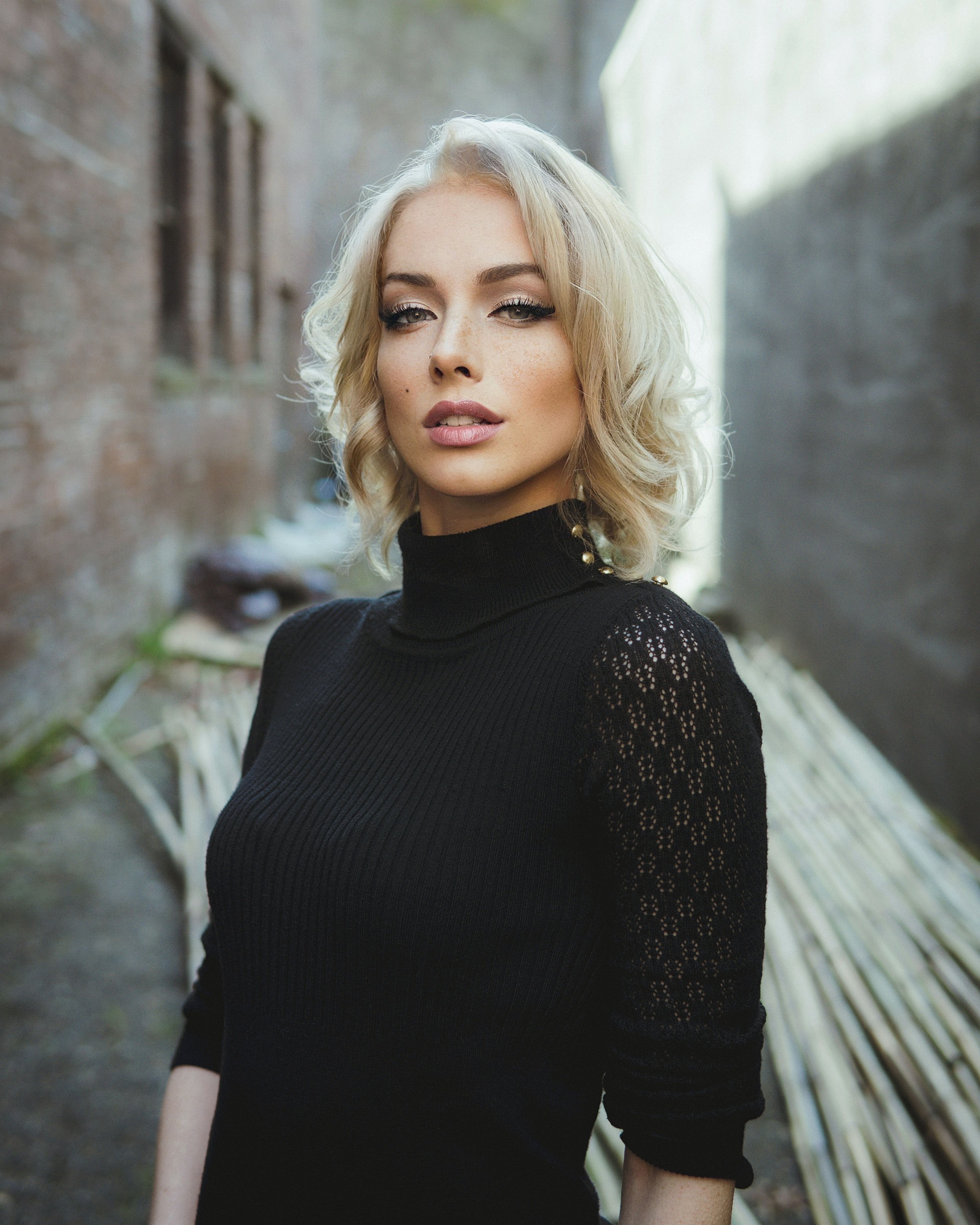 Portrait of a Young Woman in a Black Turtleneck · Free Stock Photo