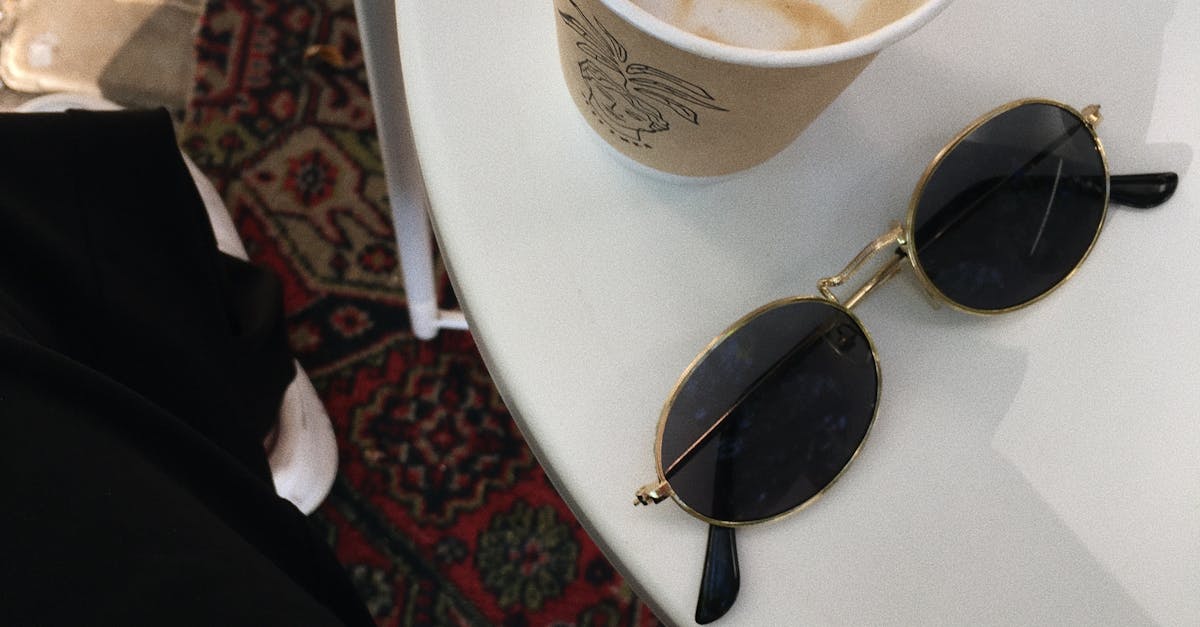 Sunglasses on Table with Coffee