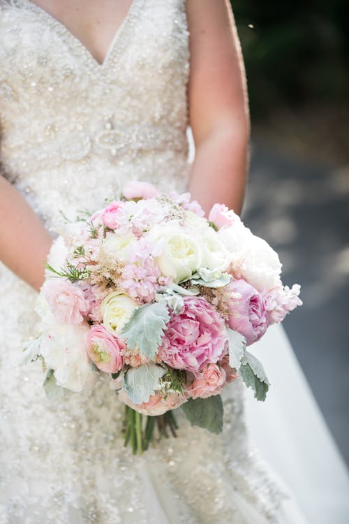 Close up of Bride with Flowers Bouquet