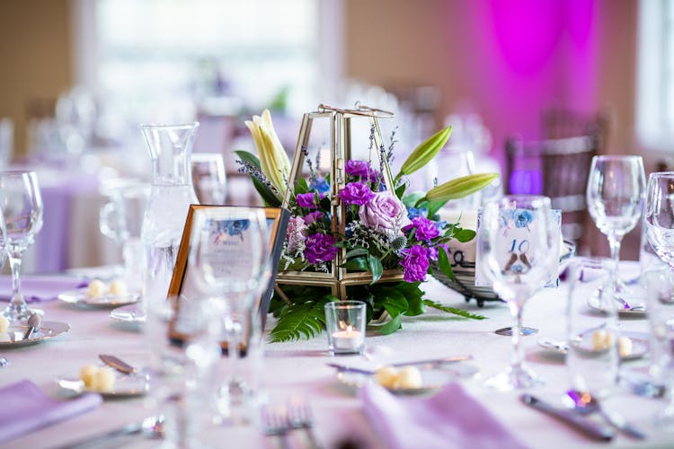 Flowers Decor On Table Setting In Restaurant