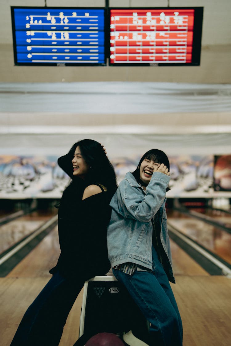 Laughing Friends In A Bowling Alley