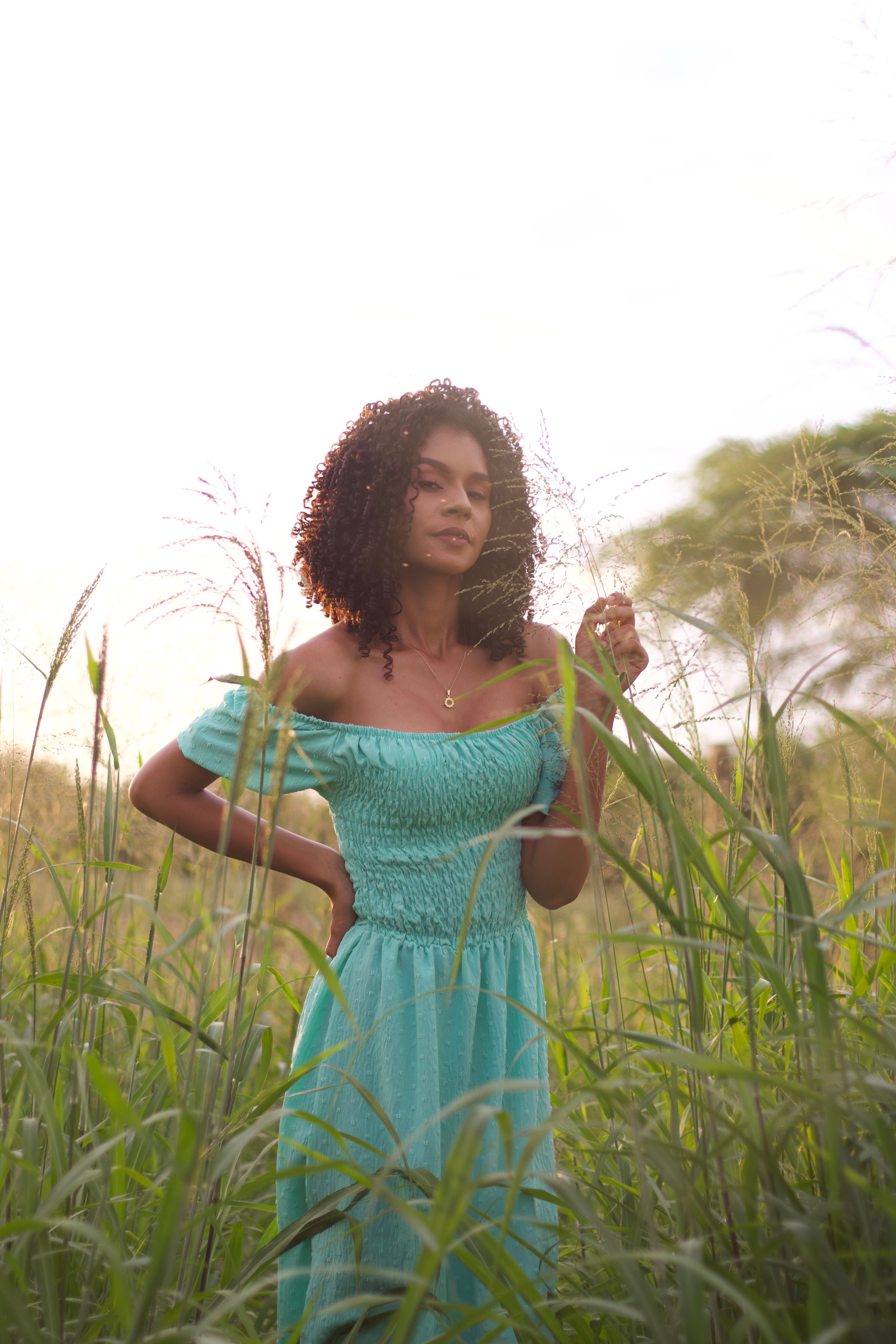 Young Woman in a Dress on a Grass Field · Free Stock Photo
