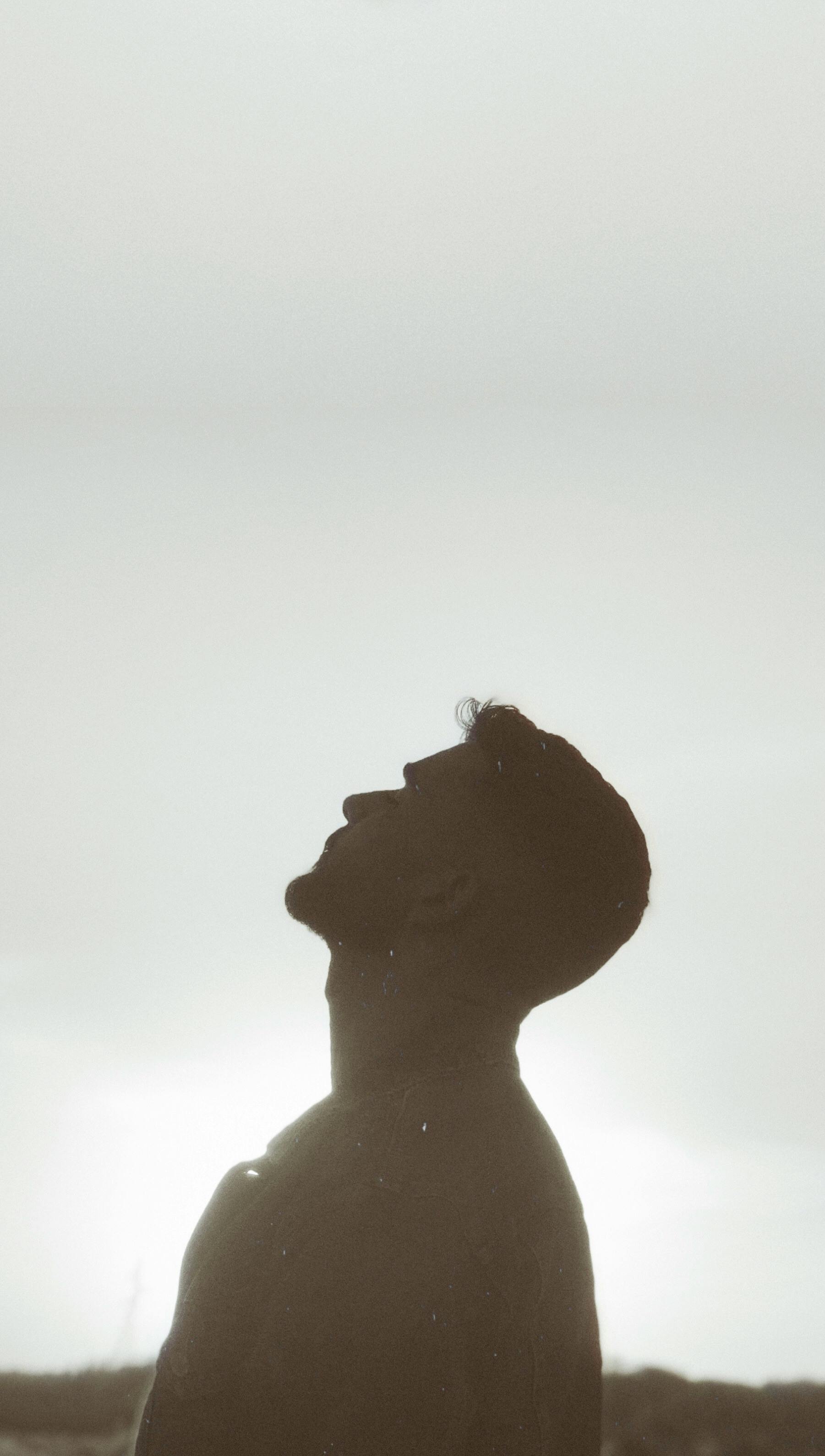 Silhouette Of A Man Looking Up · Free Stock Photo