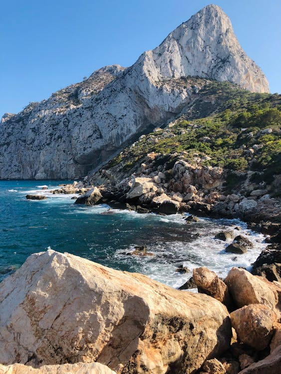 Rocks and Mountain on Sea Shore