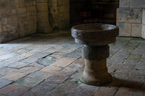 A Statue Inside an Antique Marble Building 