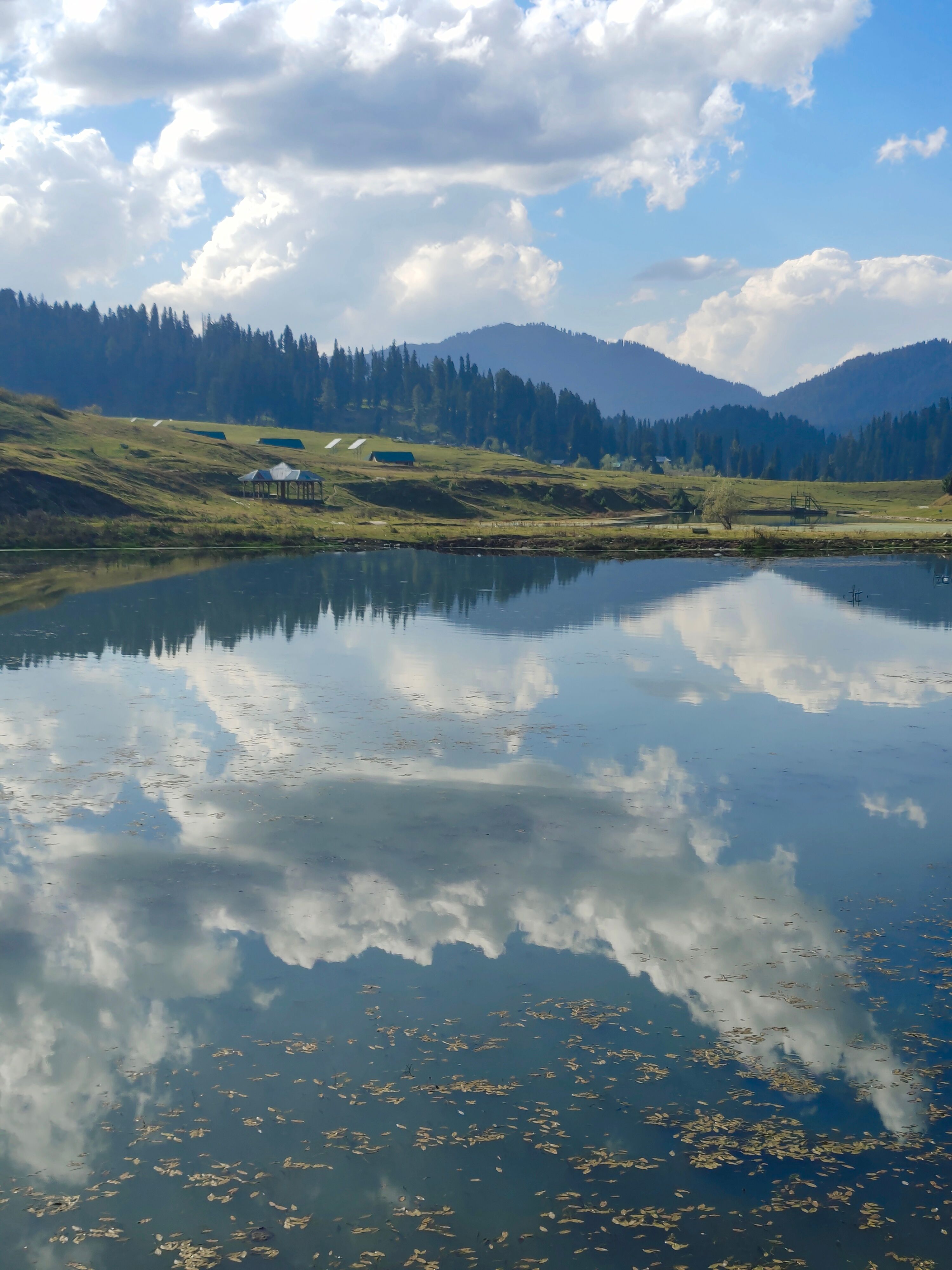 Clouds Reflecting in a Mountain Lake · Free Stock Photo