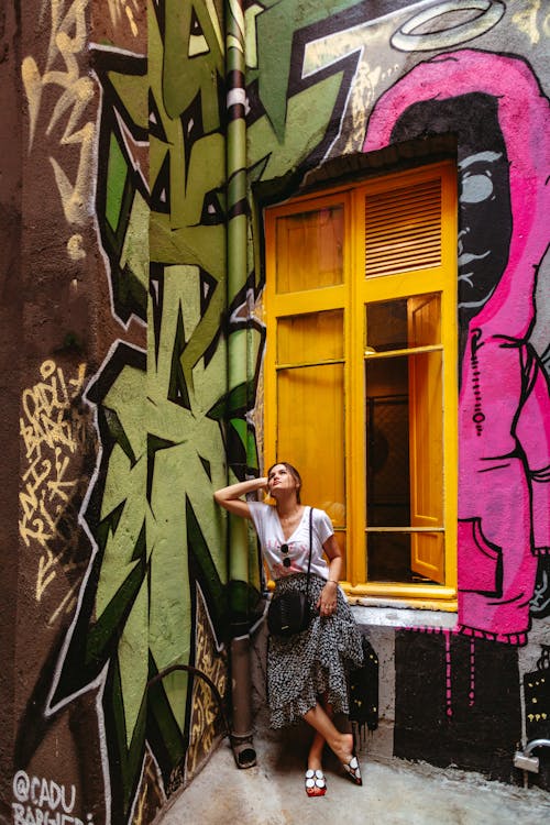 Woman Posing by Walls with Graffiti