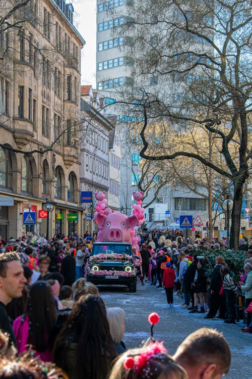 Car with Large Pink Pig on Roof on Street of Stuttgart, Germany