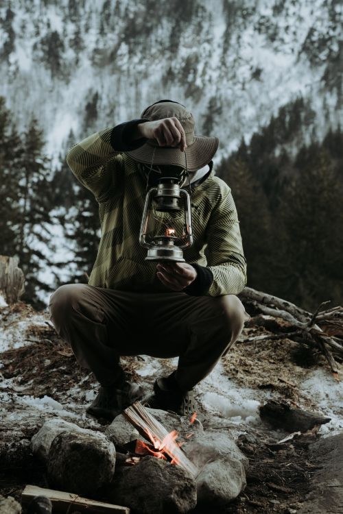 Free A hiker with a lantern in a snowy Greek mountain setting. Stock Photo