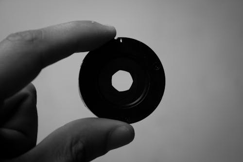 Close-up of Man Holding a Camera Lens Shutter