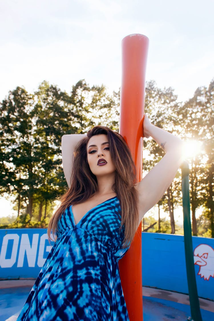 Young Woman In A Blue Summer Dress