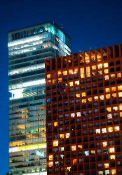 Modern skyscrapers light up the night sky in Mexico City's financial district.