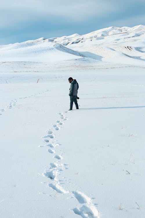 Free Man Standing on Snow Area Stock Photo