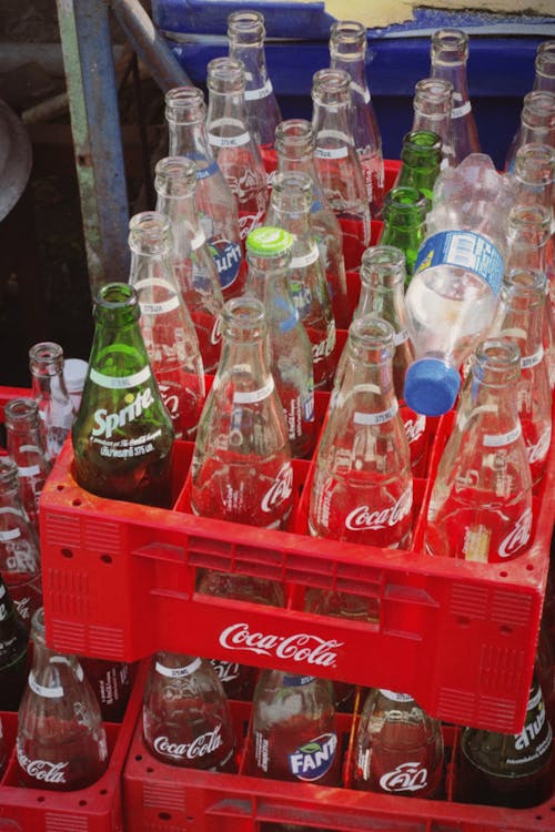 Empty Glass Bottles in a Plastic Crate