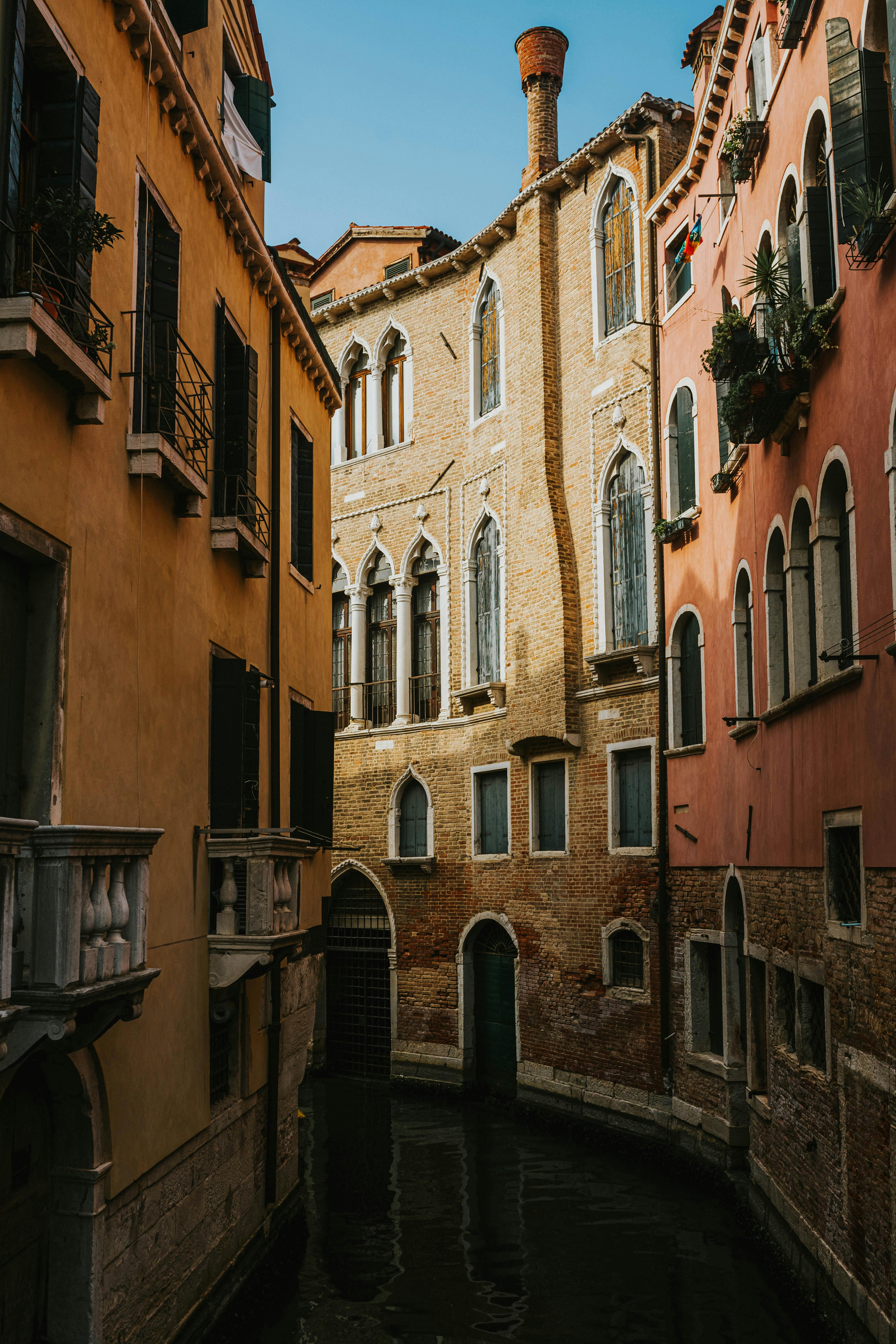 Charming Venetian canal lined with historic buildings in old town Venice, Italy.