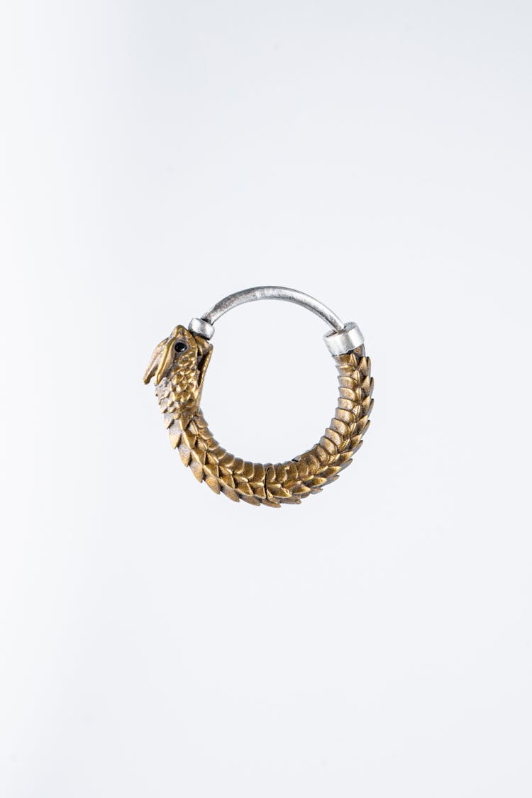 Gold Earring In White Background 