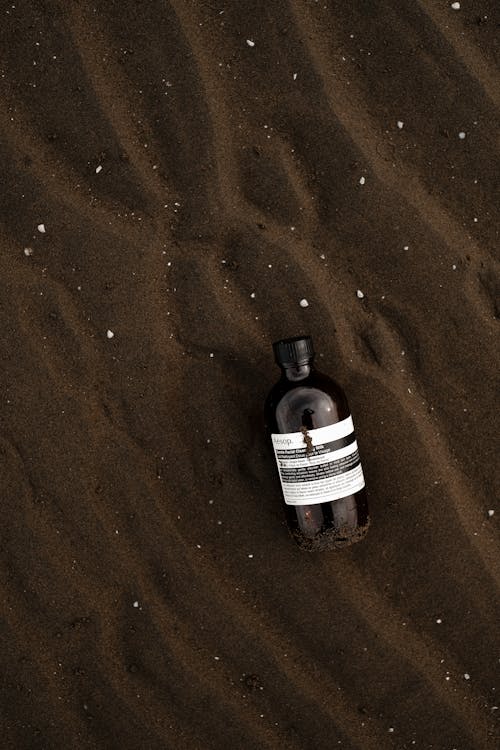 Soap in a Bottle on a Beach 