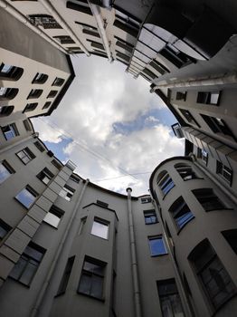 Circular view of a residential courtyard with sky above in Saint Petersburg.