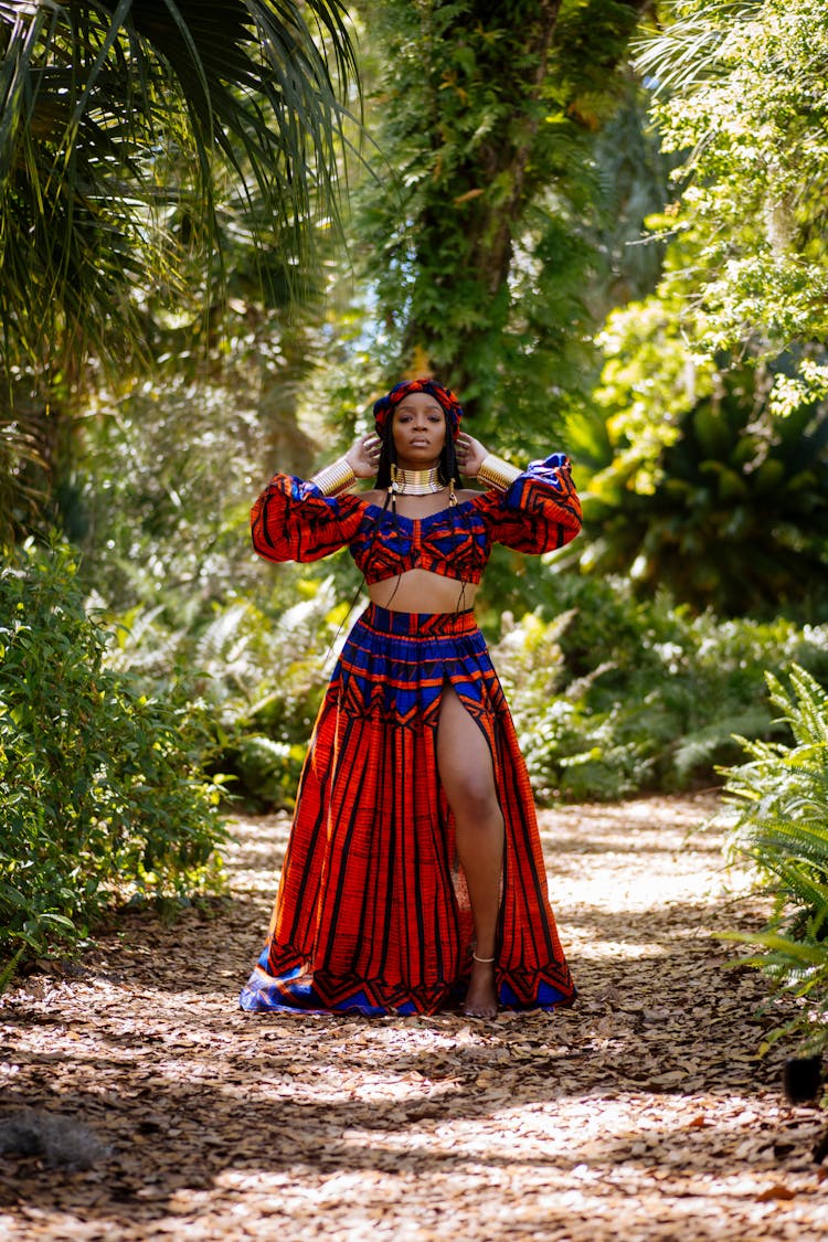 Woman In Traditional Clothing Posing On Footpath In Forest