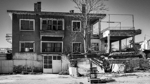 Free Black and white image of an abandoned and dilapidated building. Stock Photo