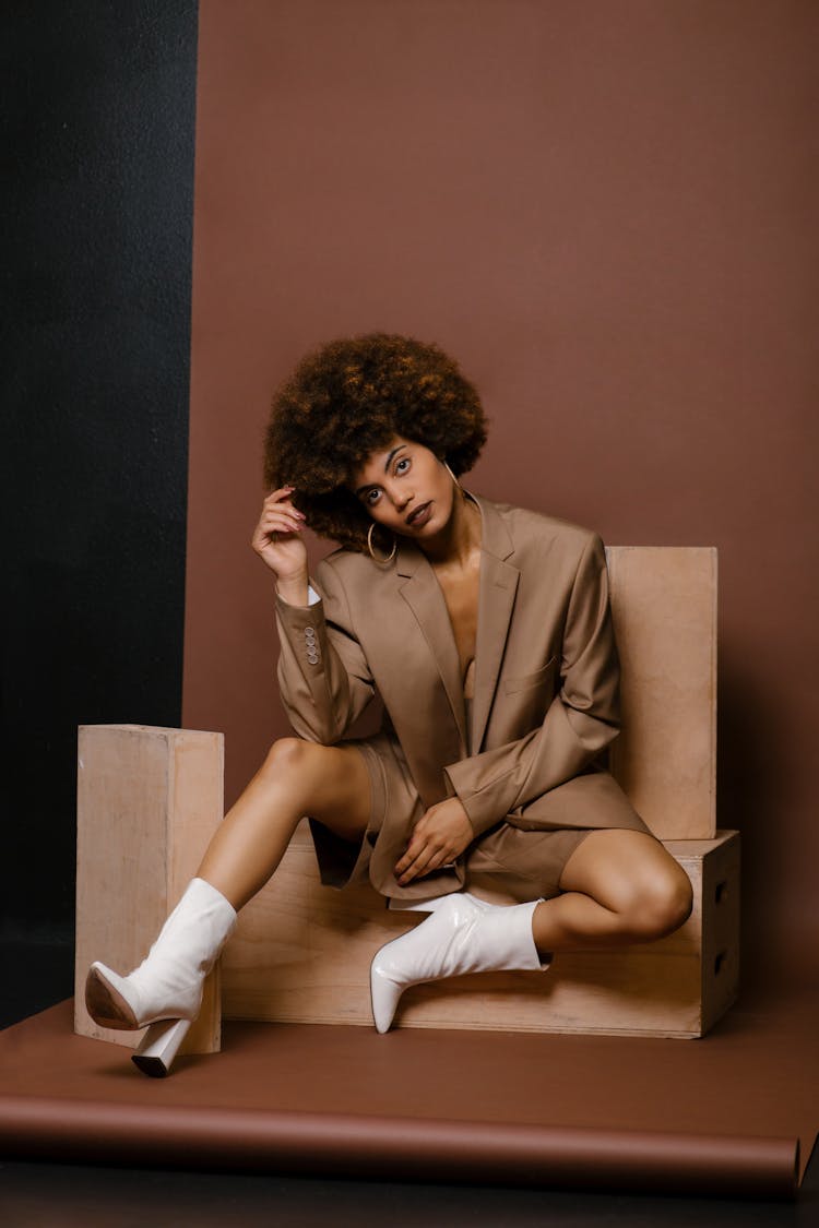 Model In A Fashionable Beige Outfit Posing In Studio 