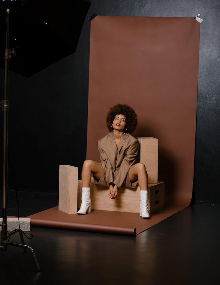 Model In A Fashionable Beige Outfit Posing In Studio 