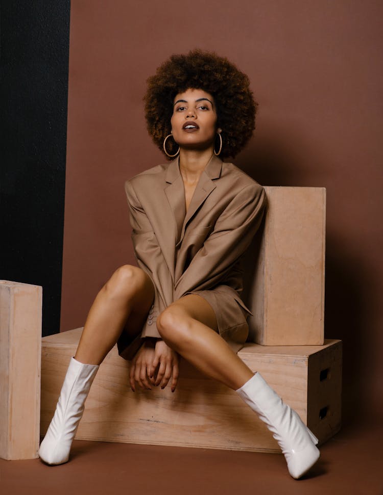 Model In A Fashionable Beige Outfit Posing In Studio 