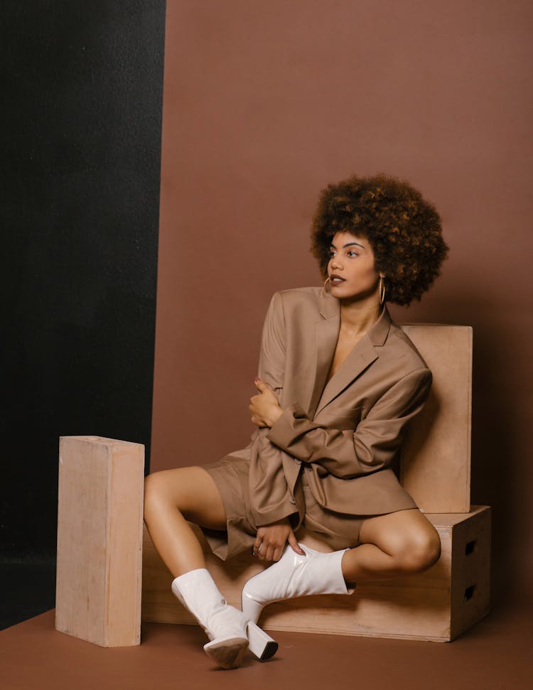 Model In A Fashionable Beige Outfit Posing In Studio 