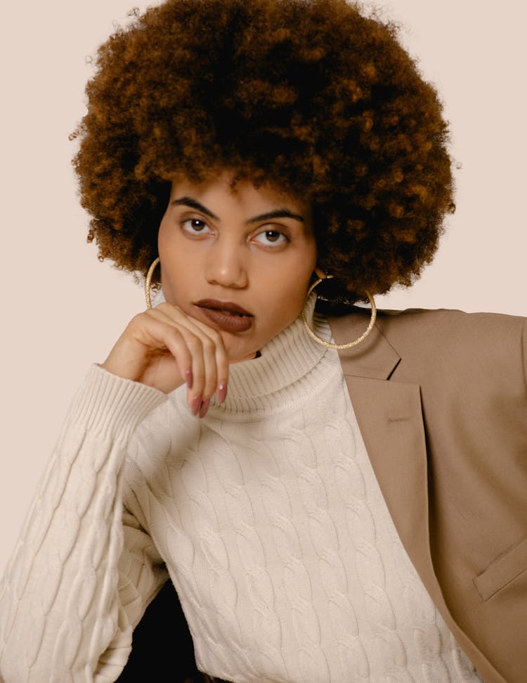 Model In A Fashionable Beige Outfit Posing In Studio 