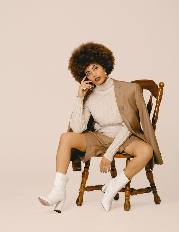 Model In A Fashionable Beige Outfit Posing In Studio 