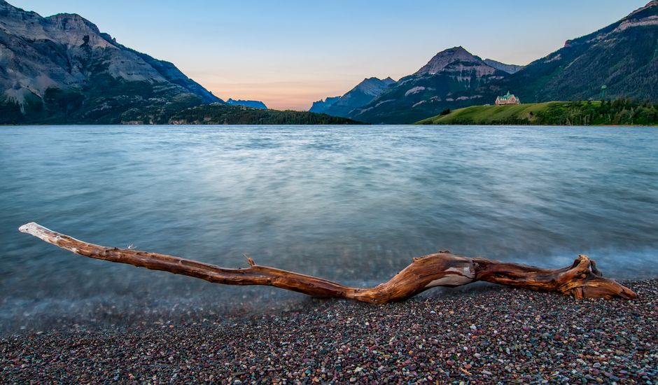 Beautiful landscape of Waterton Lake with mountains at sunrise in Waterton Park, Canada.