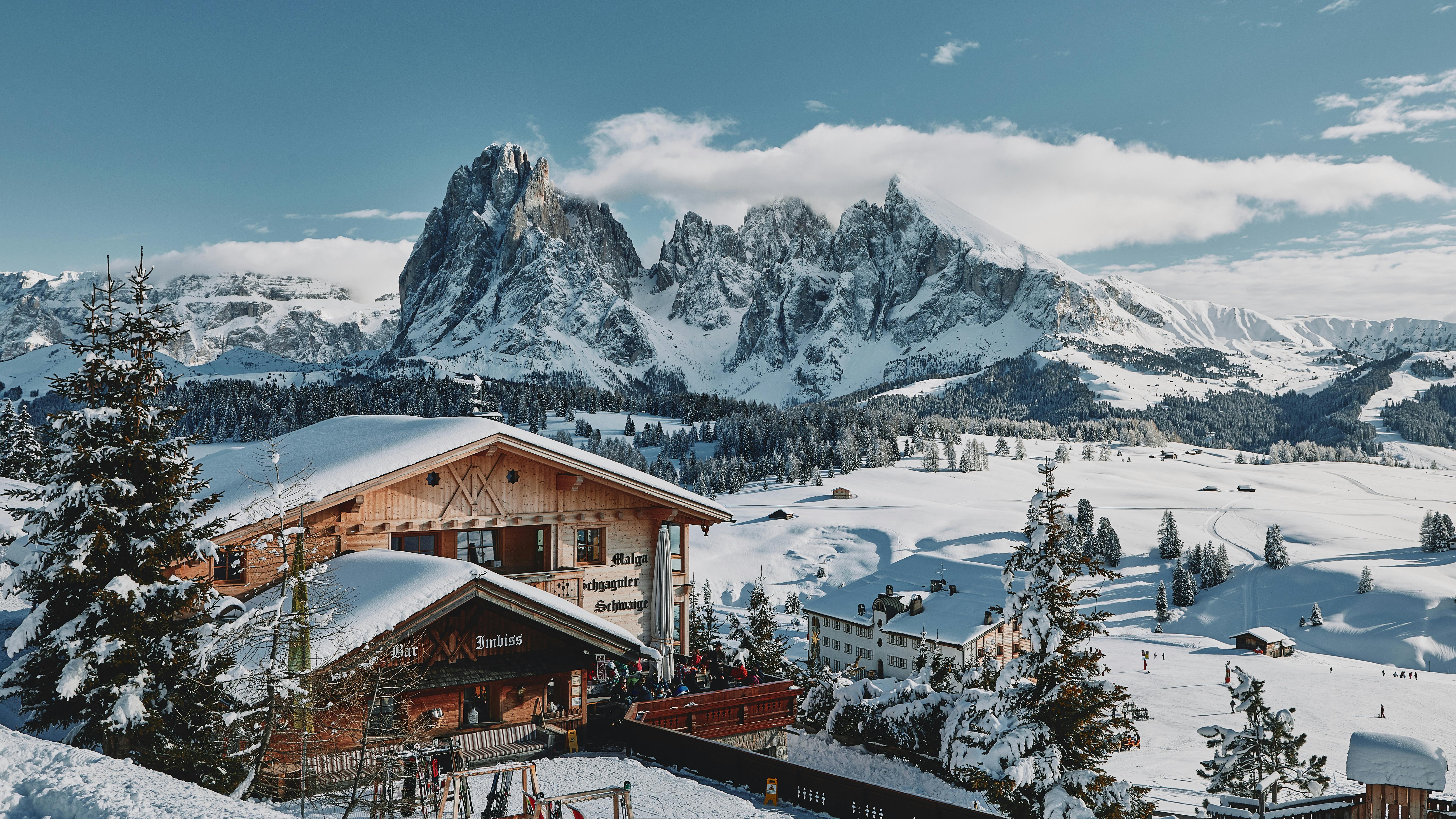 Prescription Goggle Inserts - Breathtaking winter view of snow-covered Dolomites in Italy with a charming wooden chalet.