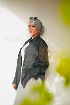 Portrait of a fashionable woman in Casablanca wearing a hijab and sunglasses, with a modern outfit.