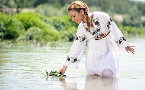 Free Woman in White Dress in the Water at Daytime Stock Photo