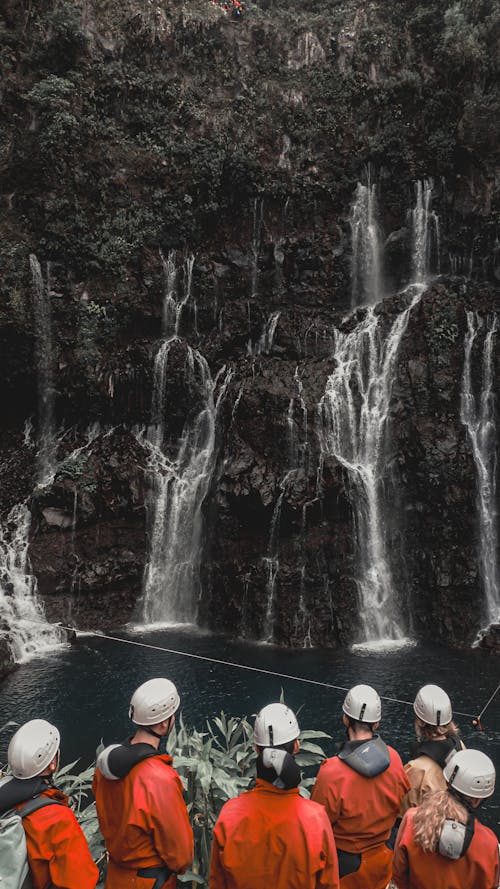 People Standing near Waterfalls