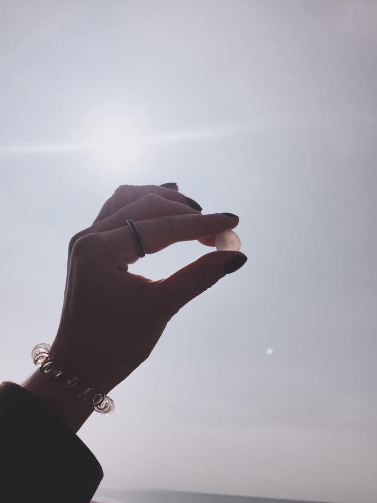 Hand Holding A Rock 