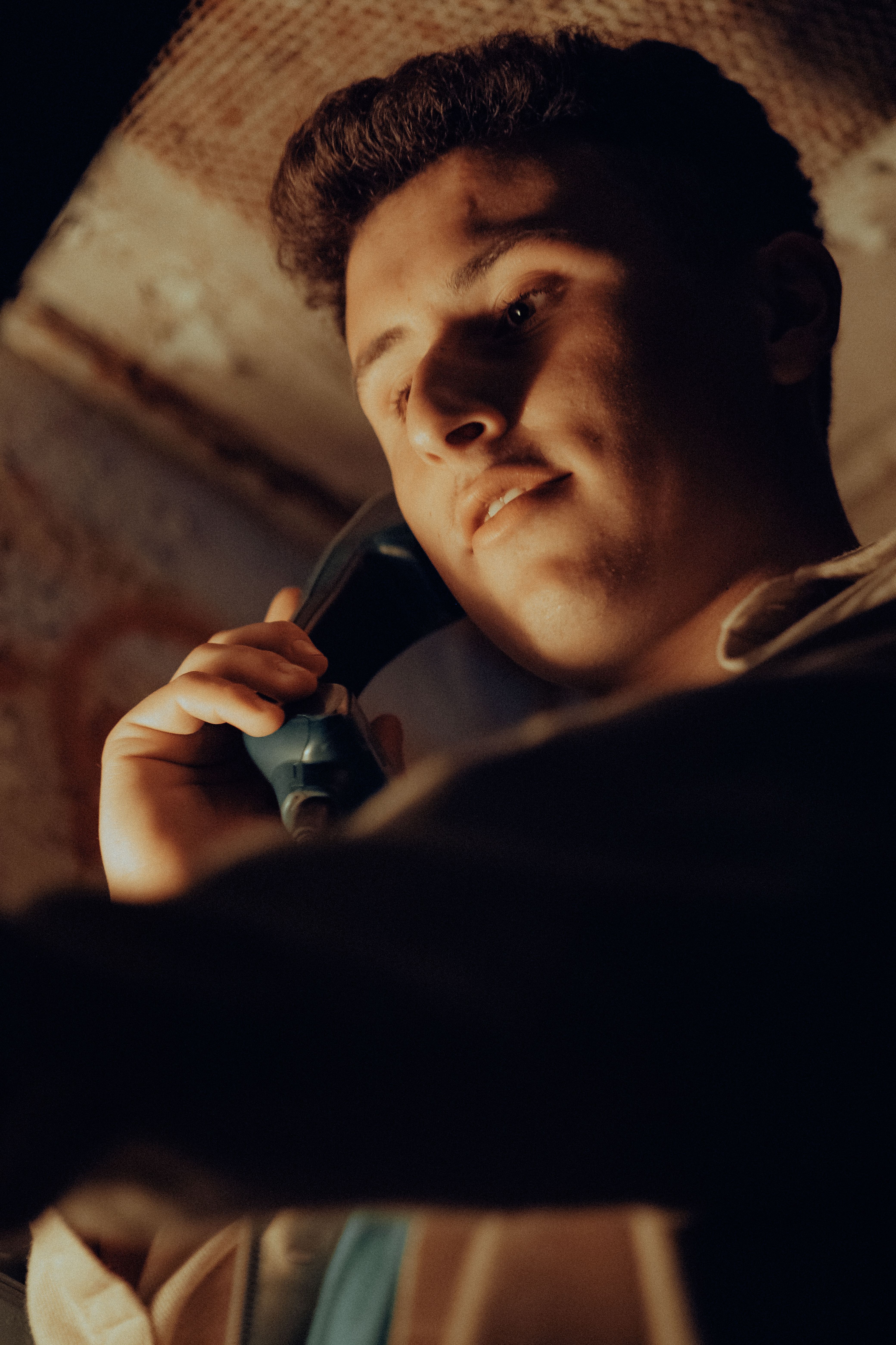Young Man Using a Payphone · Free Stock Photo