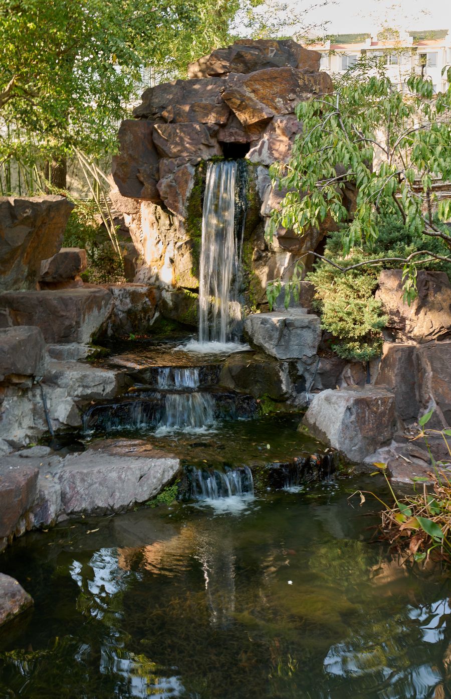 Natural garden waterfall in tropical landscape