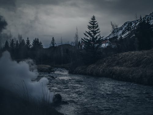 River in Mountains on Gloomy Day