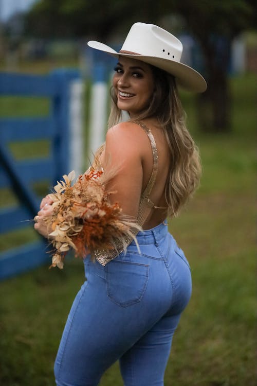 Woman in Jeans and Cowboy Hat