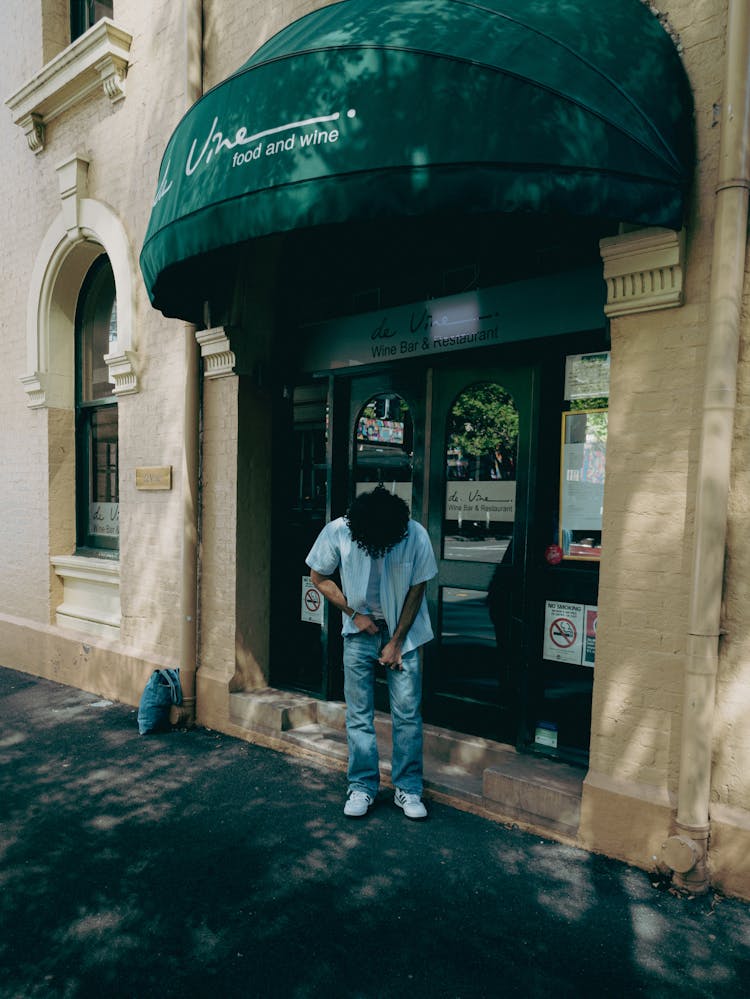 Man In Front Of Bar