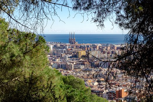 Panoramic view of Barcelona city with coastline and Central Thermal power station in the distance.