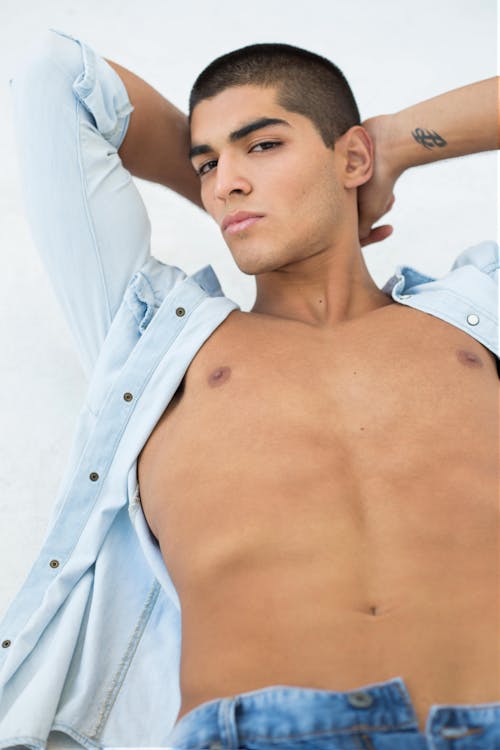 Young Man Posing with an Unbuttoned Shirt 