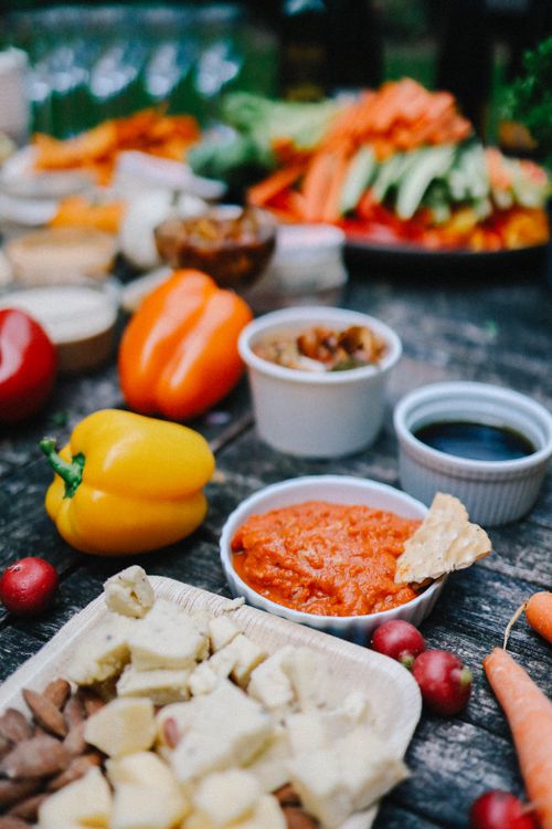 Free A vibrant display of fresh vegetables and dips on a rustic table setting. Stock Photo